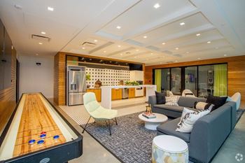 Modern club room with shuffle board, entertainment kitchen, coffee bar and complimentary wifi